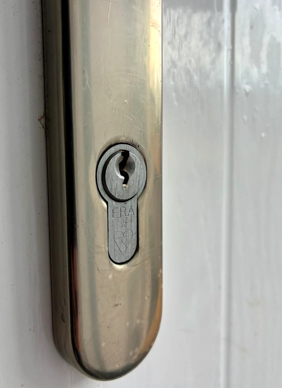 ERA euro cylinder set in a silver door handle plate