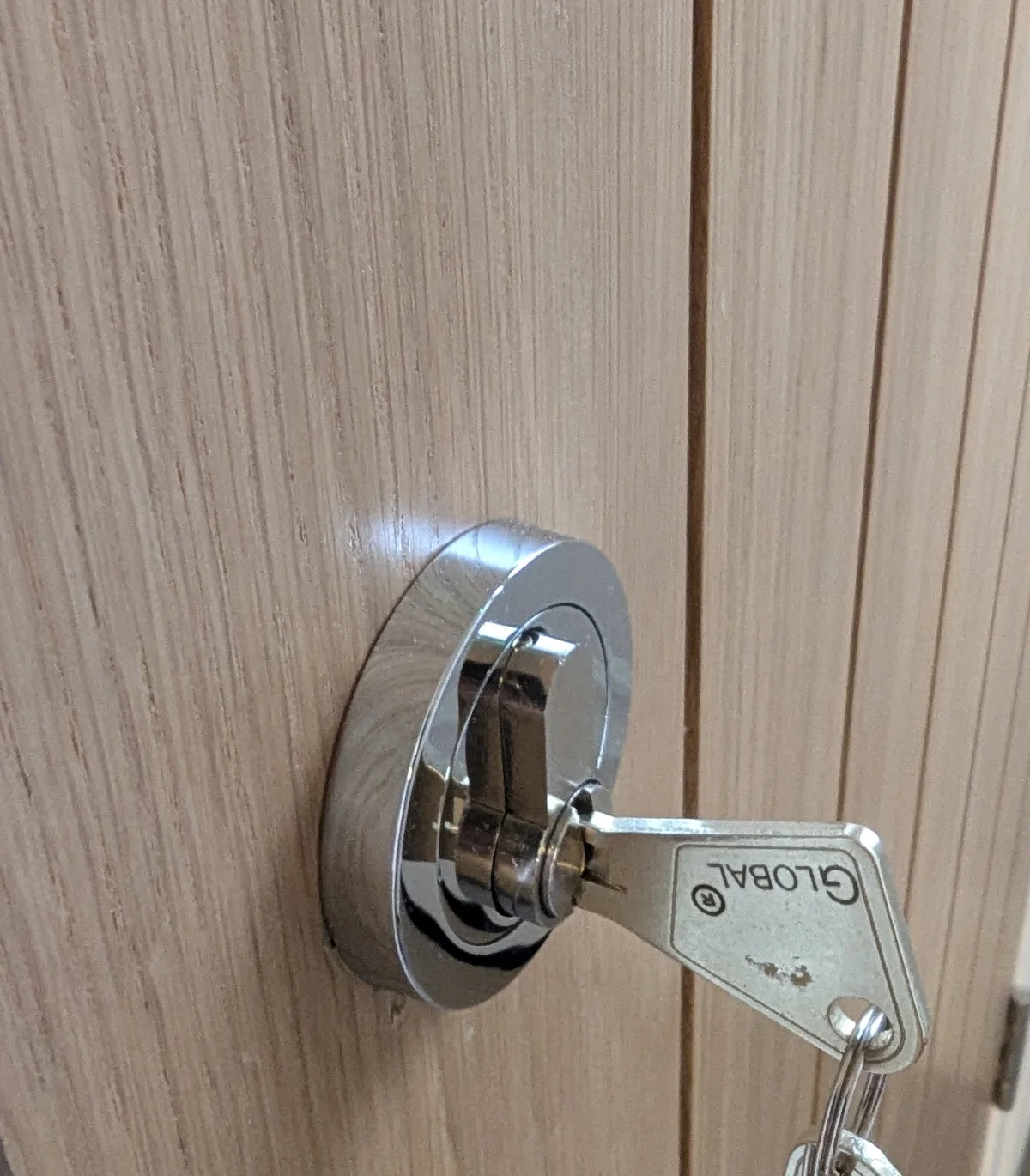 Internal door cylinder lock fitted for controlled property access with key details protected