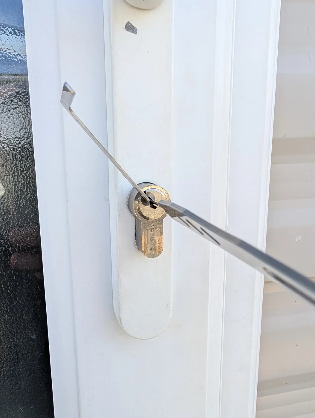Lock servicing tool being used on a euro cylinder during locksmith work