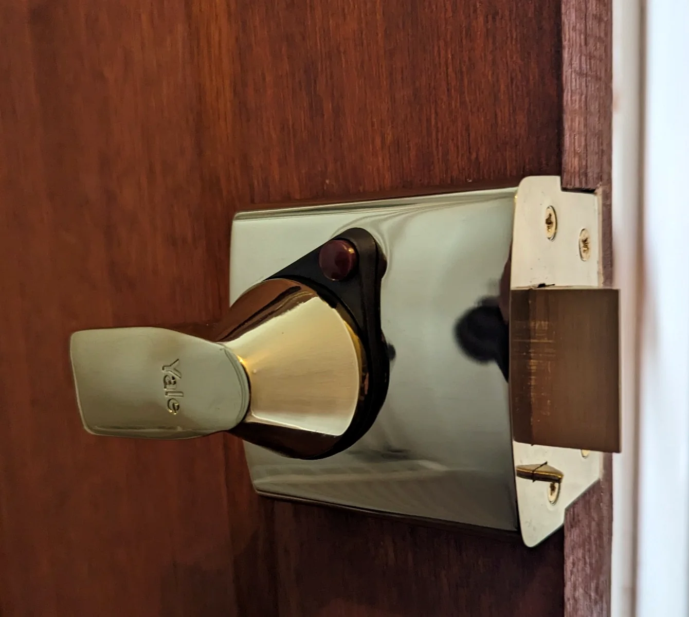Yale nightlatch fitted on the inside of a timber door