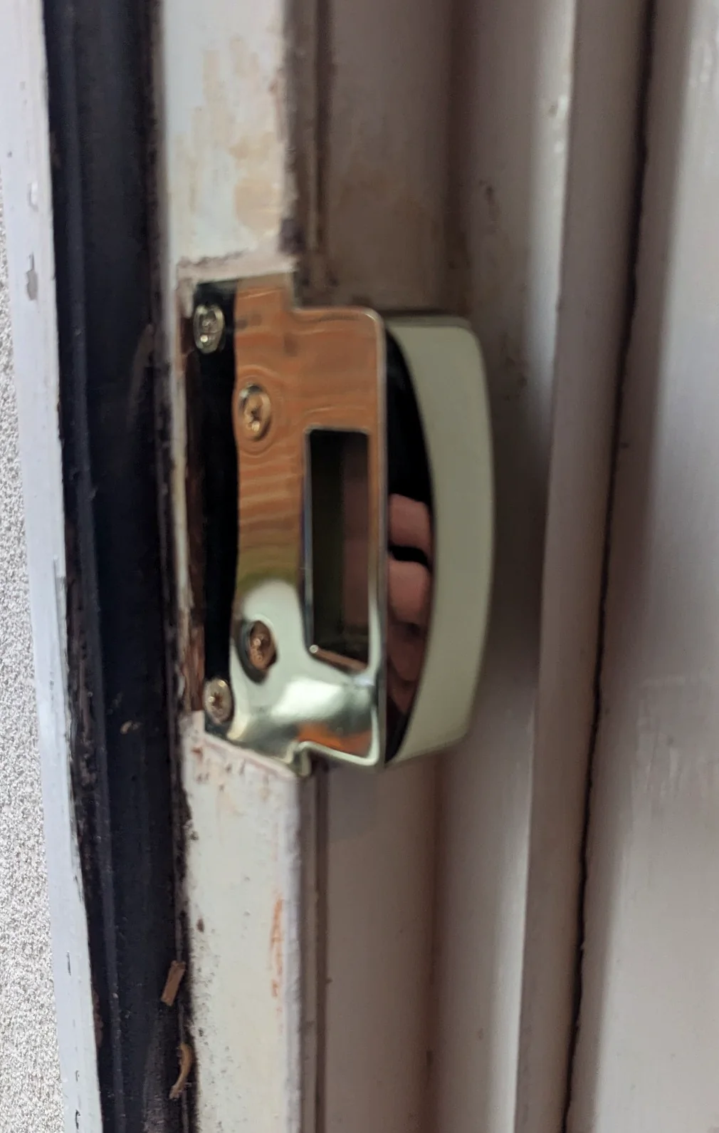 Yale nightlatch keep fitted to a door frame